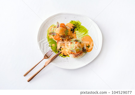 Bao with pulled beef, pumpkin sauce and arugula 104529077