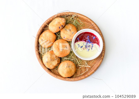 Ruddy cottage cheese pancake with sauce isolated Ruddy cottage cheese pancake with sauce isolated 104529089