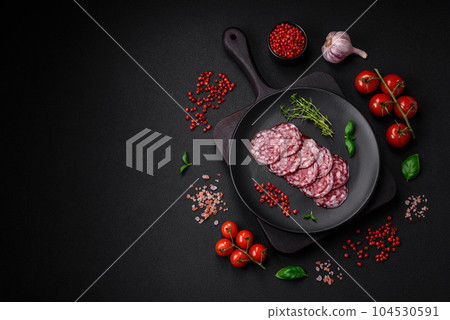 Delicious smoked sausage with bacon, salt, spices and herbs 104530591