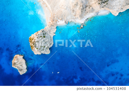View from the air on the waves and rocks. Sea relaxation and travel. Azure water on the sea. View from the air on the waves and rocks. Sea relaxation and travel. Azure water on the sea. 104531408