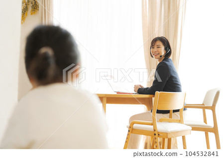 photo of mom and child working from home 104532841