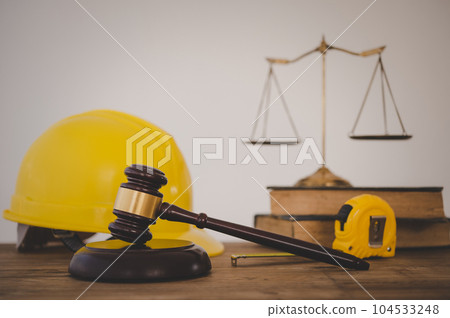 Judge's hammer and helmet Law and Justice about labor law concept Construction law.. Judge's hammer and helmet Law and Justice about labor law concept Construction law.. 104533248
