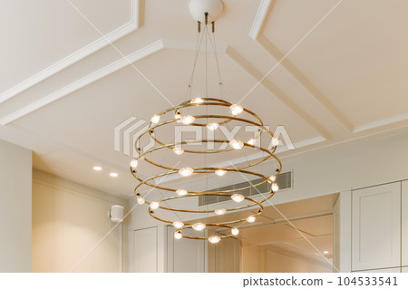 a kitchen with white cabinets and light fixtures on the ceiling above it is a chandel that has been installed a kitchen with white cabinets and light fixtures on the ceiling above it is a chandel that has been installed 104533541