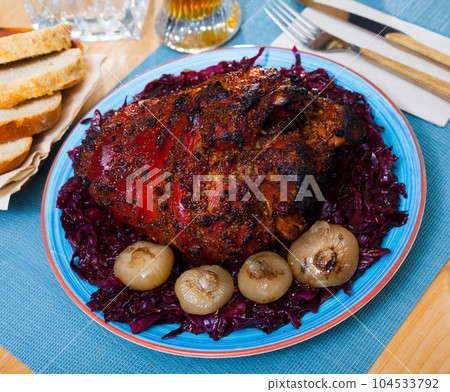 Roasted pork knuckle with braised cabbage Roasted pork knuckle with braised cabbage 104533792