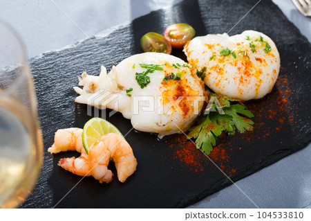 Fried cuttlefish and shrimp served with lime Fried cuttlefish and shrimp served with lime 104533810