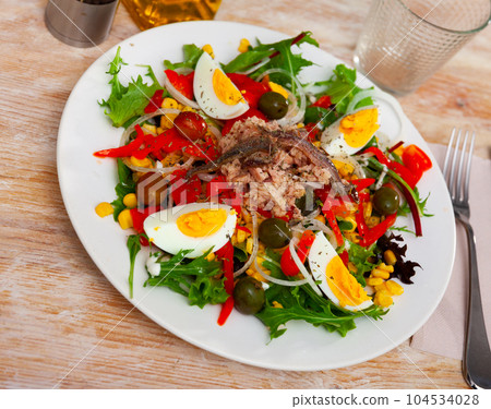 Xato salad with cod, chopped eggs and corn Xato salad with cod, chopped eggs and corn 104534028