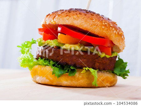 Vegetarian burger with vegetable patty Vegetarian burger with vegetable patty 104534086