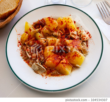 Fried pigs ear with species at plate 104534307