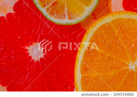 Citrus fruits slices - orange, grapefruit and lime - close up, top view 104534860