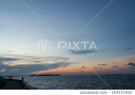 The evening sky of the Caribbean Sea dyed in pale orange The evening sky of the Caribbean Sea dyed in pale orange 104535404