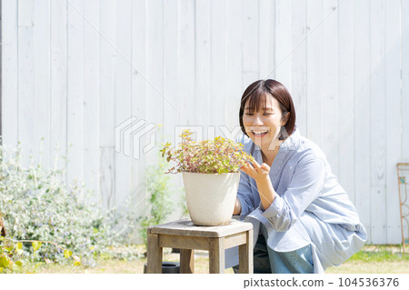 Photo of a woman growing plants 104536376