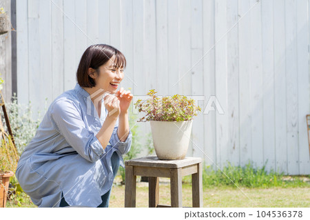 Photo of a woman growing plants Photo of a woman growing plants 104536378