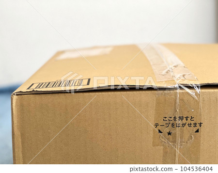 Close-up cardboard box with transparent tape 104536404