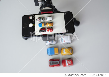 Image of taking a picture with a smartphone Image of taking a picture with a smartphone 104537816