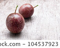 Closeup passion fruit with slice on wooden background, fruit healthy concept 104537923