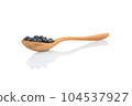 Closeup black beans seeds in wooden bowl on white background, healthy food concept 104537927