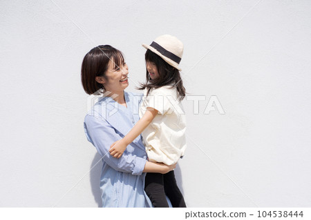 photo of parent and child hugging photo of parent and child hugging 104538444