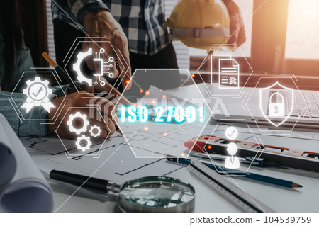 ISO 27001 Quality standards assurance business technology concept, Business team analyzing income charts and graphs with iso 27001 icon on virtual screen. 104539759