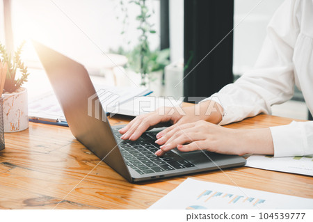Bussinesswoman hand working on laptop computer at the table in the office, Business concept with copy space. 104539777