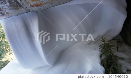 Snow interestingly slid down from the roof Snow interestingly slid down from the roof 104540010