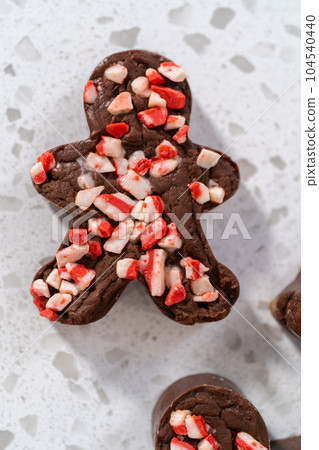 Freshly made Christmas cookie-cutter peppermint fudge on the kitchen counter. 104540440
