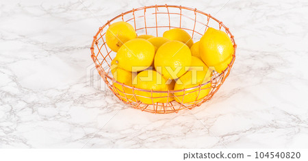 Ingredients in glass mixing bowls to prepare lemon bundt cake. 104540820
