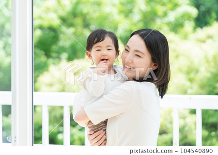 Mom holding a 9-month-old baby (family, family, parent and child, childcare, childcare, child) 104540890