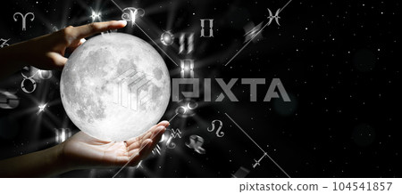 Astrological zodiac signs over the moon in hand. Knowledge of the stars in the sky. The power of the universe concept. Astrological zodiac signs over the moon in hand. Knowledge of the stars in the sky. The power of the universe concept. 104541857