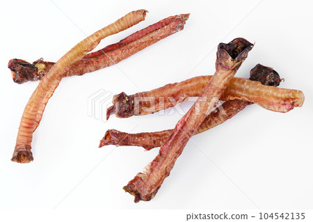 Top view of natural dried treats for dogs isolated on white Top view of natural dried treats for dogs isolated on white 104542135