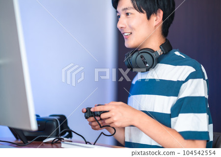 Young man enjoying video games 104542554