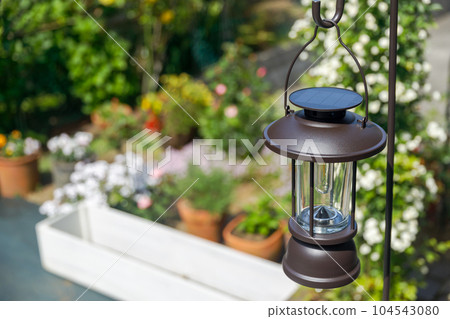 Charging a solar lantern with sunlight 104543080