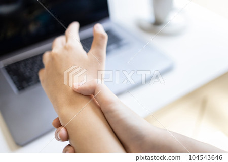 Concept of Carpal Tunnel Syndrome,De Quervain's Tenosynovitis,Office Syndrome,occupational disease,work with laptop computer,typing on keyboard for long period of time,health illness problems  104543646