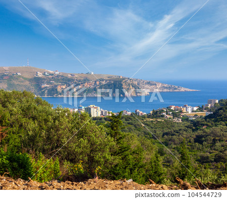 Summer coast view and town on shore (Albania) Summer coast view and town on shore (Albania) 104544729
