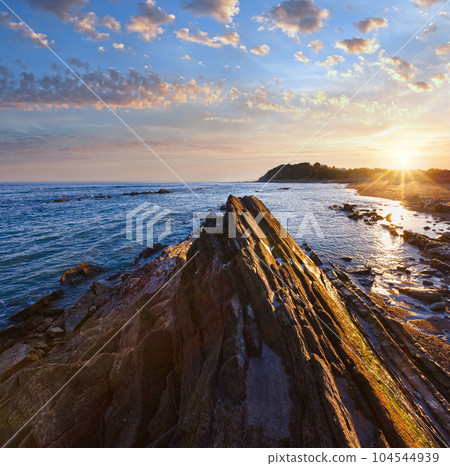 Sunrise ocean view from beach (Bay of Biscay). Sunrise ocean view from beach (Bay of Biscay). 104544939