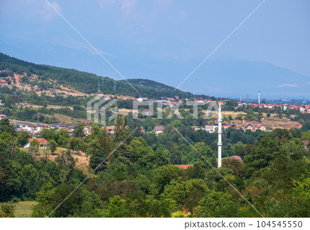 Summer Balkan mountains village countryside view in North Macedonia, Europe. Debar province, North Macedonia, Europe. Summer Balkan mountains village countryside view in North Macedonia, Europe. Debar province, North Macedonia, Europe. 104545550