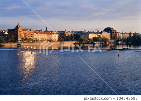 Prague city glowing at sunset from Charles Bridge Prague city glowing at sunset from Charles Bridge 104545695