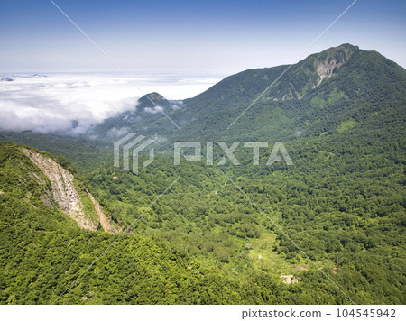 View of Mt. Onagisa, Mt. Amakazari and a sea of clouds, Otari Village, Nagano Prefecture (aerial photography by drone) View of Mt. Onagisa, Mt. Amakazari and a sea of clouds, Otari Village, Nagano Prefecture (aerial photography by drone) 104545942