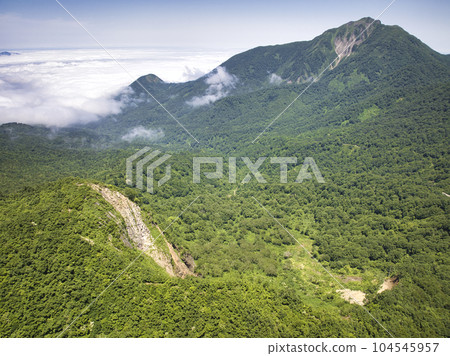 View of Mt. Onagisa, Mt. Amakazari and a sea of clouds, Otari Village, Nagano Prefecture (aerial photography by drone) View of Mt. Onagisa, Mt. Amakazari and a sea of clouds, Otari Village, Nagano Prefecture (aerial photography by drone) 104545957