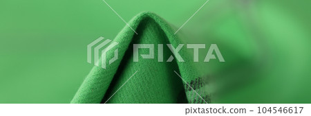 Green woolen fabric with black lines, textile cloth texture background 104546617