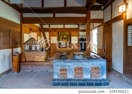 The kitchen of a farmhouse in a circle and a tatami room with a raised Buddhist altar in the Kiso Sansen Park Center in Kaizu City, Gifu Prefecture 104546621