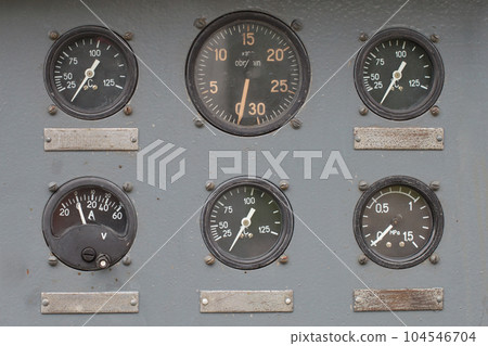 Close up rustic control panel of old machine. Close up rustic control panel of old machine. 104546704