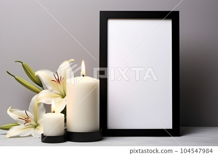 mourning white candle and white lilies, free space, empty frame 104547984