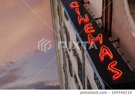Red neon lights at dusk in the city 104548116