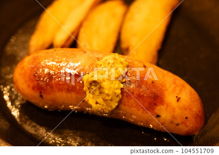 Delicious hot sausage and fries Delicious hot sausage and fries 104551709