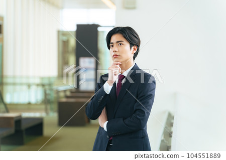 Young businessman thinking in the office 104551889