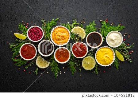 Sauces in bowls with seasonings 104551912