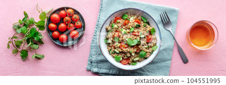 Quinoa tabbouleh salad in a bowl, a healthy dinner with tomatoes and mint Quinoa tabbouleh salad in a bowl, a healthy dinner with tomatoes and mint 104551995