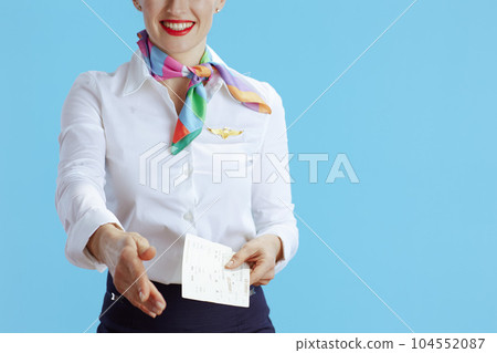 Modern flight attendant woman on blue giving hand for handshake 104552087