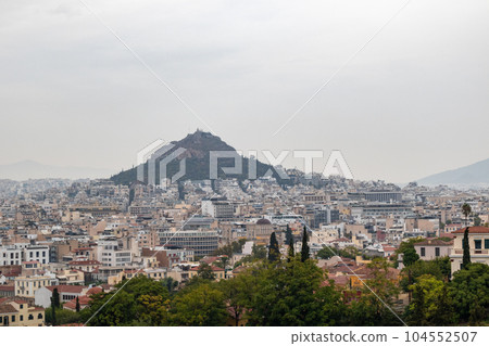 Mount Lycabettus and Athens city in fog, Greece Mount Lycabettus and Athens city in fog, Greece 104552507