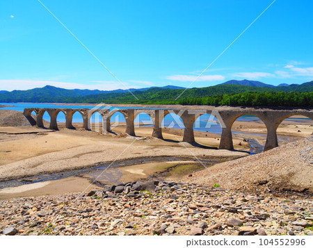 Blue sky and Taushubetsu river bridge of former Japanese National Railways Shihoro Line 104552996